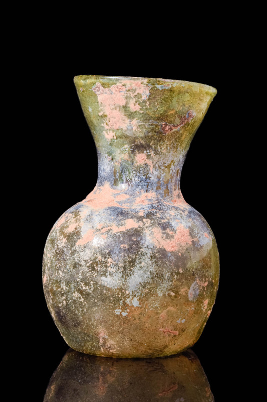 ROMAN GLASS DATE SHAPED UNGUENTARIUM

 Ca. AD 100 - 200 A Roman glass date sha...