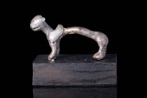 ROMAN OR PARTHIAN SILVER GRIFFIN HANDLE 

 Ca. 200 BC A Roman or Parthian silver handle in the shape of a griffin with a long and tubular body. It s...