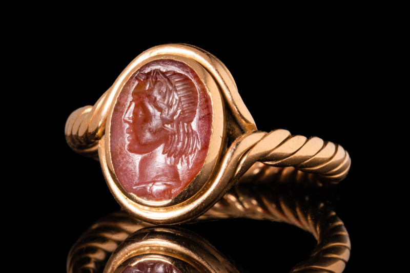 ROMAN CARNELIAN INTAGLIO DEPICTING ALEXANDER THE GREAT IN GOLD RING

 CA. AD 1...