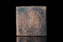 BYZANTINE BRONZE INLAID WEIGHT WITH CROSS 

 Ca. AD 1000 - 1300 A Byzantine square weight, cast from bronze. The front is inscribed "IHS" inside of ...
