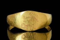 BYZANTINE GOLD RING INSCRIBED WITH 'SAINT JOHN"

 Ca. AD 800 - 1000 A Byzantine gold ring with large band hoop with D section widening to form an ov...