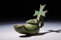 BYZANTINE BRONZE OIL LAMP WITH CROSS SHAPED HANDLE

 Ca. AD 400 - 600 A Byzantine bronze oil lamp, the body of which has an ovoid form with gently s...