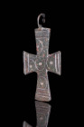 BYZANTINE BRONZE CROSS WITH THE 5 WOUNDS OF CHRIST

 Ca. AD 800 - 1000 A Byzantine solid bronze cross-shaped pendant decorated with five dots/circle...