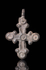 BYZANTINE BRONZE CROSS WITH THE 5 WOUNDS OF CHRIST

 Ca. AD 800 - 1000 A Byzantine bronze cross-shaped pendant, decorated with five moulded dots/cir...