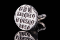 BYZANTINE SILVER STAMP SEAL WITH INSCRIPTION

 Ca. AD 800 - 1100 A Byzantine stamp seal with a hexagonal-shaped bezel inscribed with Greek letters. ...