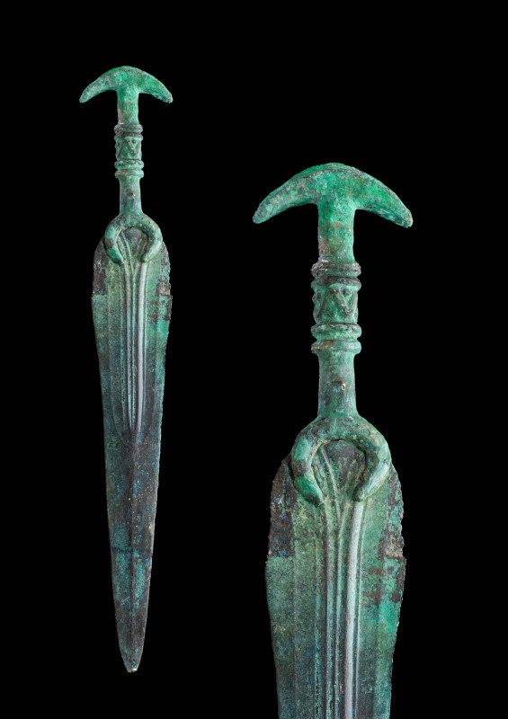 WESTERN ASIATIC BRONZE DAGGER WITH CRESCENT SHAPE GUARD

Ca. 1200 - 800 BC A W...