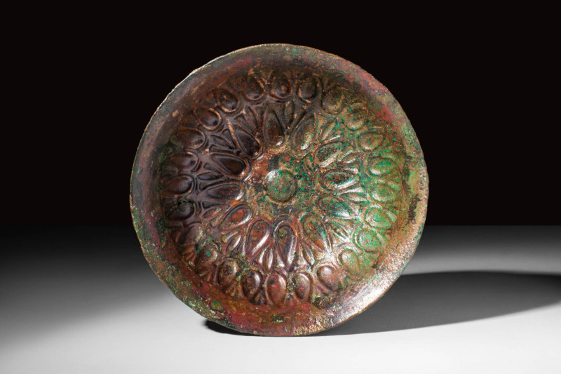 ACHAEMENID SILVER REPOUSSÉ LOTIFORM PHIALE

 Ca. 500 - 400 BC An Achaemenid si...