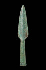 BRONZE AGE SOCKETED SPEARHEAD

 Ca. 1200 - 800 BC A Bronze Age spearhead featuring a leaf shaped blade with a slightly raised midrib, leading to a l...