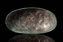 SASANIAN SILVER BOWL WITH CENTRAL CLOVERLEAF

 Ca. AD 200 - 400 A finely hammered Late Sasanian boat-shaped silver bowl, featuring a smooth, curvy c...