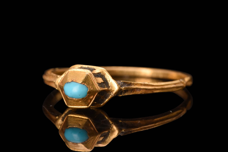 RENAISSANCE GOLD AND TURQUOISE RING

 Ca. AD 1600 A gold finger ring featuring...