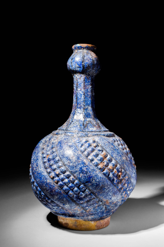 RARE KASHAN BLUE GLAZED BOTTLE WITH PROTRUDING DECORATIONS

 Ca. AD 1200 - 130...