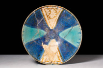 RARE KASHAN GLAZED BOWL 

 Ca. AD 1150 - 1300 A Kashan metallic lustre decorated bowl adorned with deep blue and green glaze on the interior. The de...