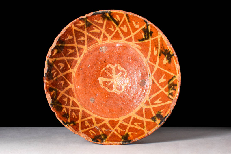 NISHAPUR BOWL WITH ENGOBE DECORATION

 Ca. AD 900 - 1000 A Nishapur red glazed...