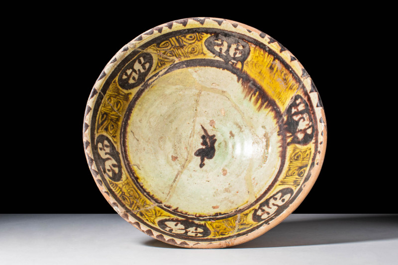 NISHAPUR GLAZED BOWL WITH FLORAL DECORATION

 Ca. AD 900 - 1000 A Nishapur gla...