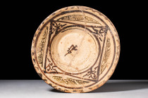 NISHAPUR GLAZED BOWL WITH PHYTOMORPHIC MOTIF

 Ca. AD 900 - 1000 A Nishapur glazed pottery bowl featuring a deep basin and convex walls painted with...