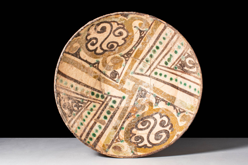 NISHAPUR GLAZED BOWL WITH GEOMETRIC CENTRAL MOTIF

 Ca. AD 900 - 1000 A Nishap...