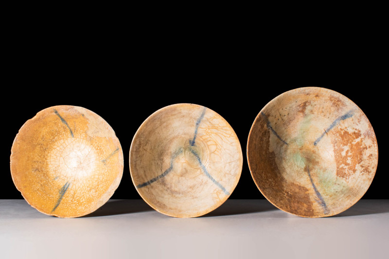GROUP OF KASHAN GLAZED BOWLS

 Ca. AD 1200 - 1400 A group of three glazed pott...