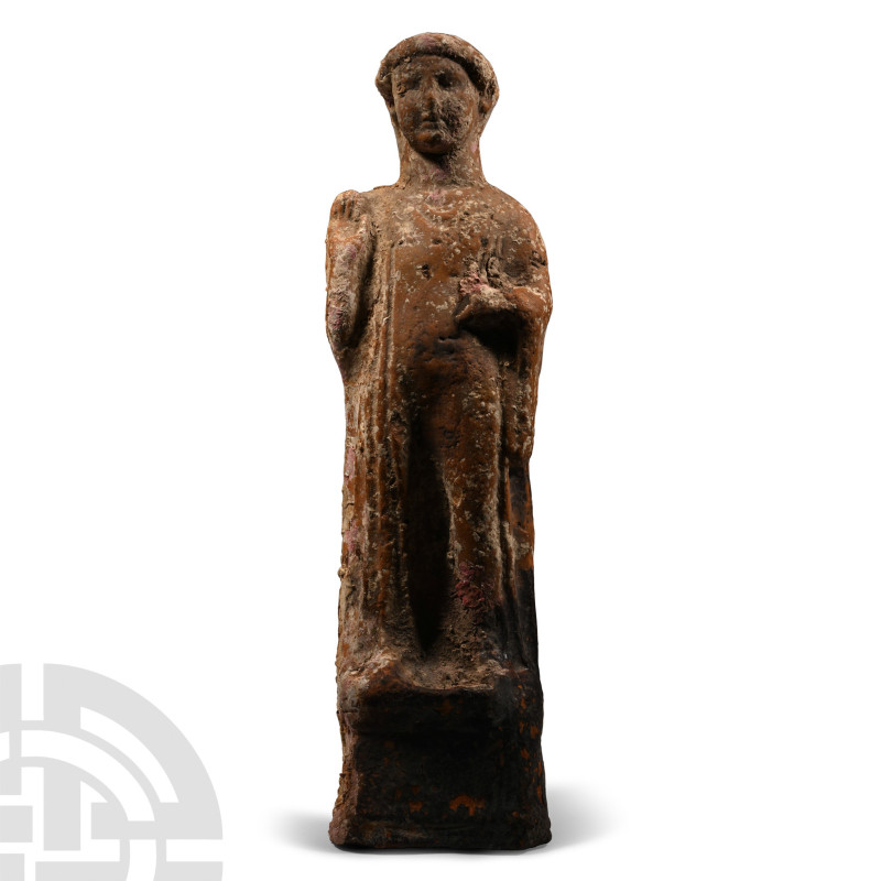 4th century B.C.. Hollow-formed standing male in floor-length robe with copious ...