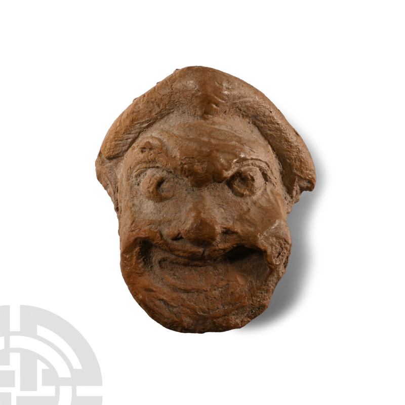 2nd-1st century B.C.. Modelled as a grotesque male head with gaping crescent-sha...