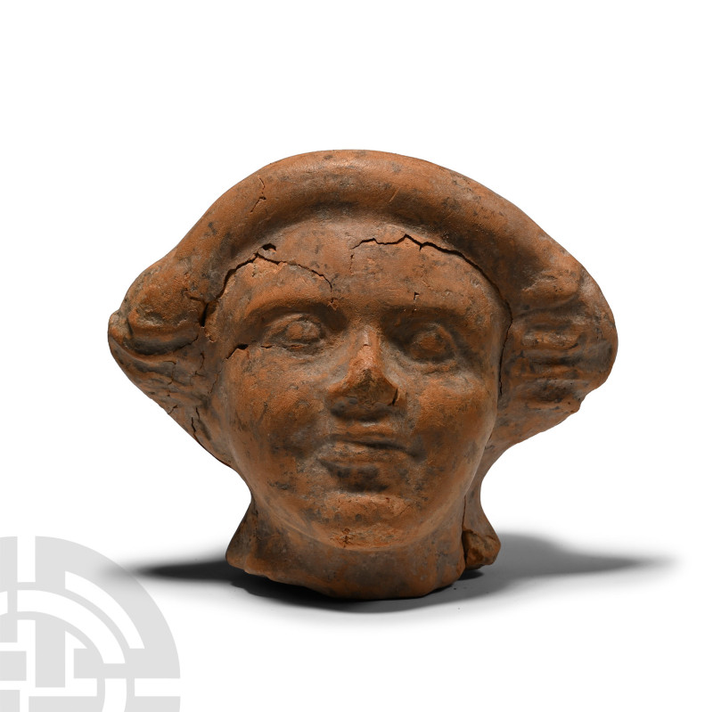 3rd-1st century B.C.. Hollow-formed with flared neck, moulded face with shallow ...