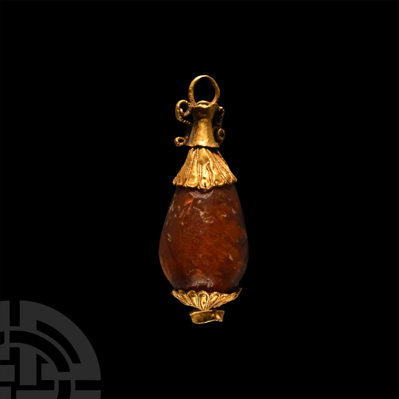 3rd-1st century B.C.. Piriform carnelian centre with gold fittings, filigree loo...