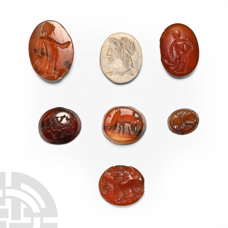 2nd-3rd century A.D.. Mainly ellipsoid carnelian plaques with incuse designs inc...