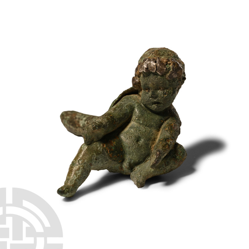 1st century A.D.. Modelled in the round, a male infant with arms and right leg e...