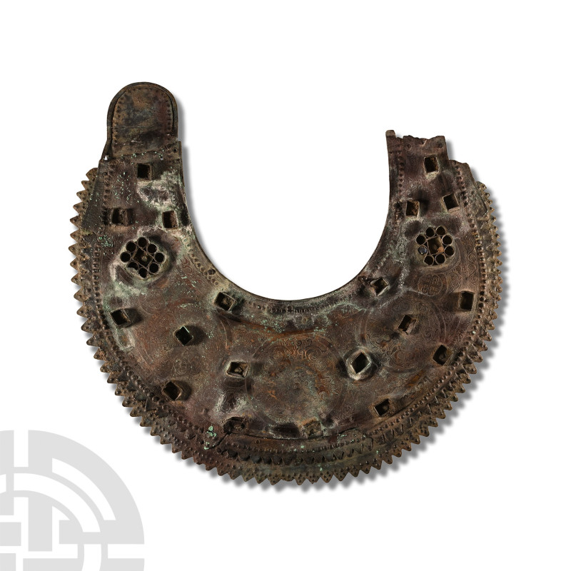 12th-14th century A.D.. Broad sheet-bronze halter-shaped collar with dentilled o...