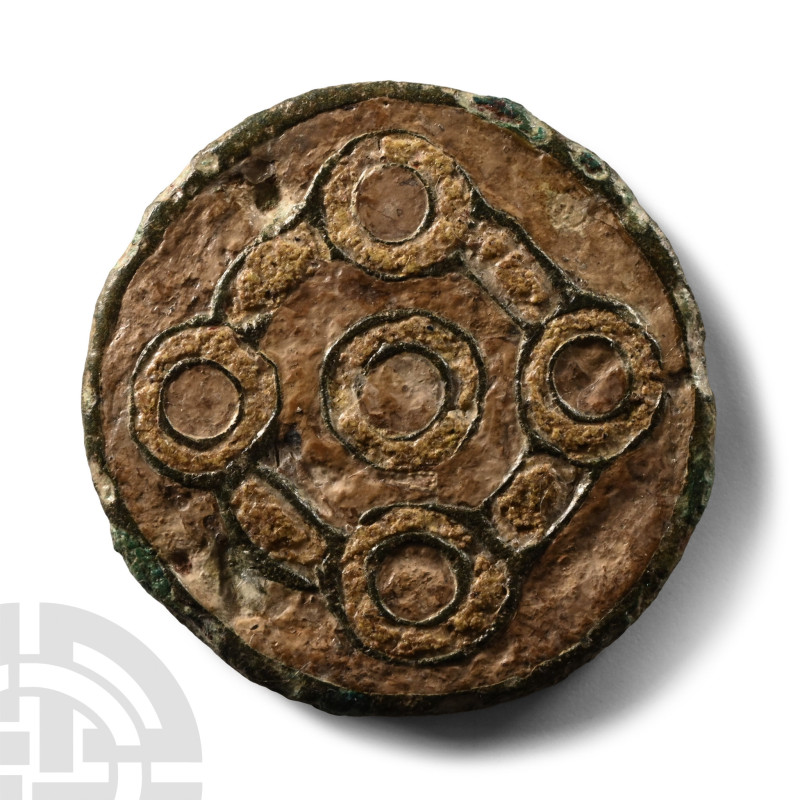 6th century A.D.. Discoid with raised rim and panel of geometric roundels and ar...