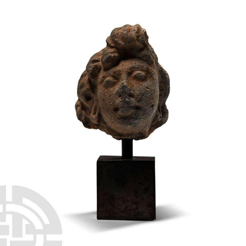 2nd-4th century A.D.. Modelled in the round as a head of a Bodhisattva with hair...