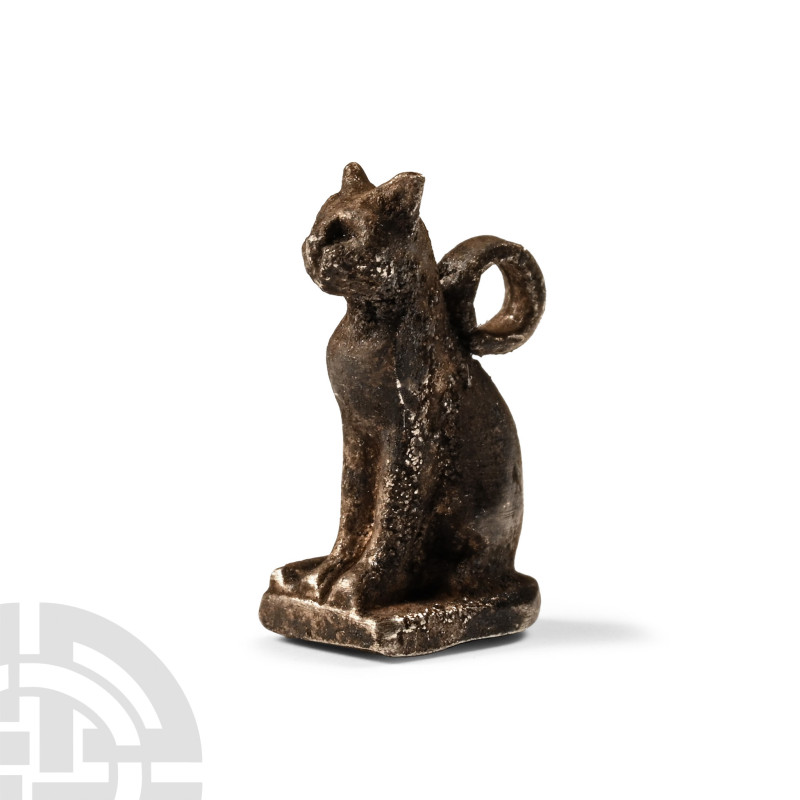 Late Period, 664-332 B.C.. Modelled seated on a tongue-shaped base, with fur det...