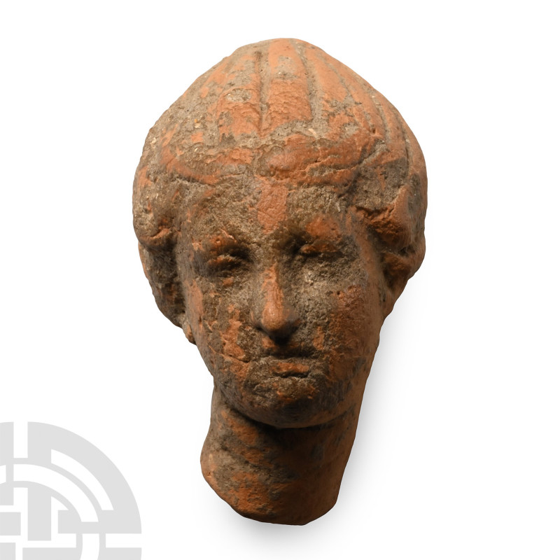 Tarentine, 3rd-1st century B.C.. Female head moulded with a segmented conical ca...