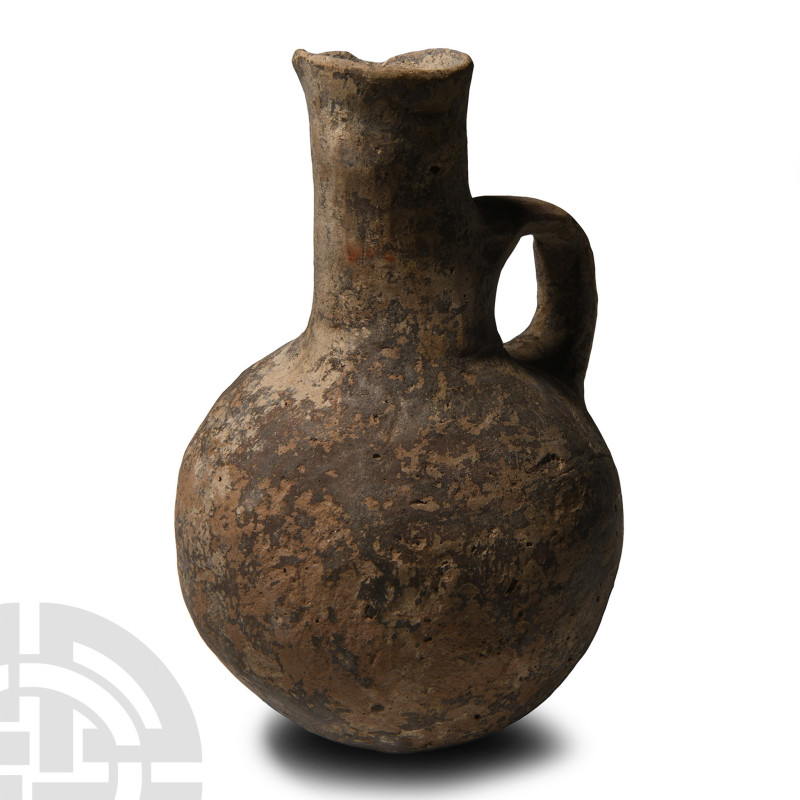 Middle Bronze Age, circa 2000-1650 B.C.. Globular in profile with tall tubular n...