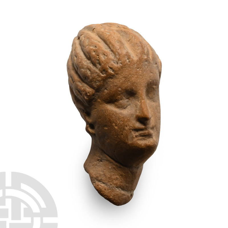 Tarentine, 3rd-1st century B.C.. Female head moulded with a segmented conical ca...