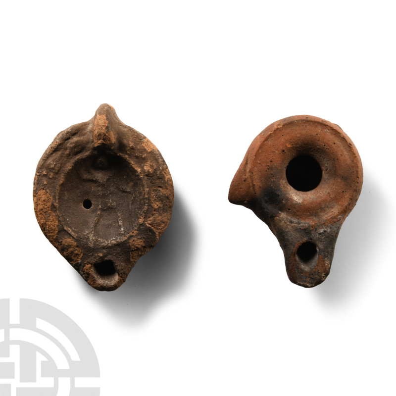 2nd-3rd century A.D.. One with lug handle to rear, discus with filling hole and ...