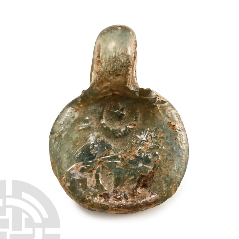 Mid 4th-mid 5th century A.D.. Discoid with integral loop, impressed image of an ...