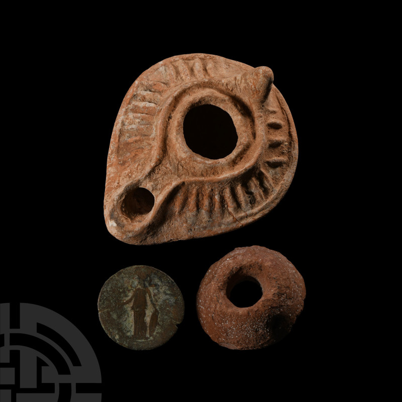 Circa 1st-5th century A.D.. A trio of artefacts comprising: a Roman copper-alloy...