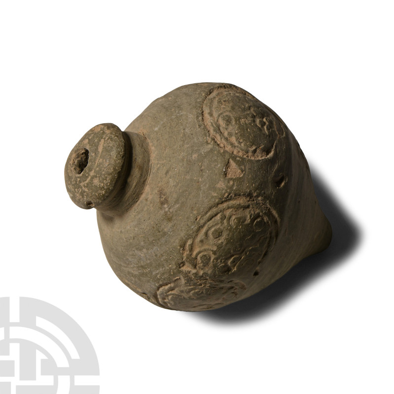 9th-11th century A.D.. Piriform body with domed filler-hole, band of rosettes wi...