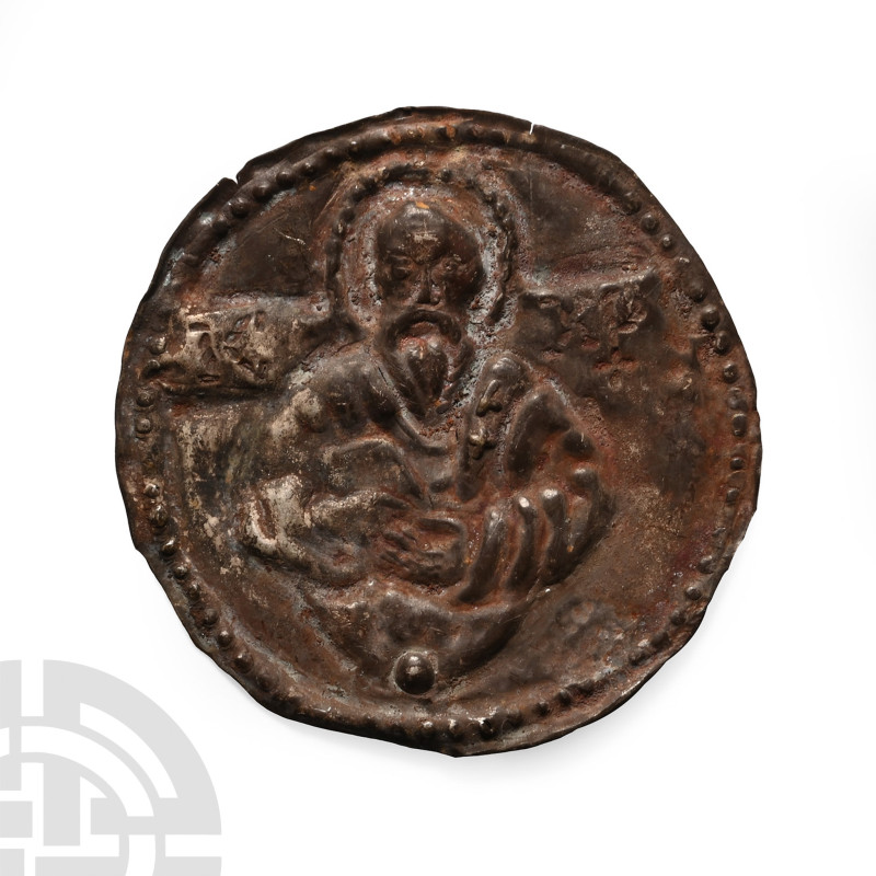 13th-14th century A.D.. Disc with repoussé pellets to the border, facing nimbate...