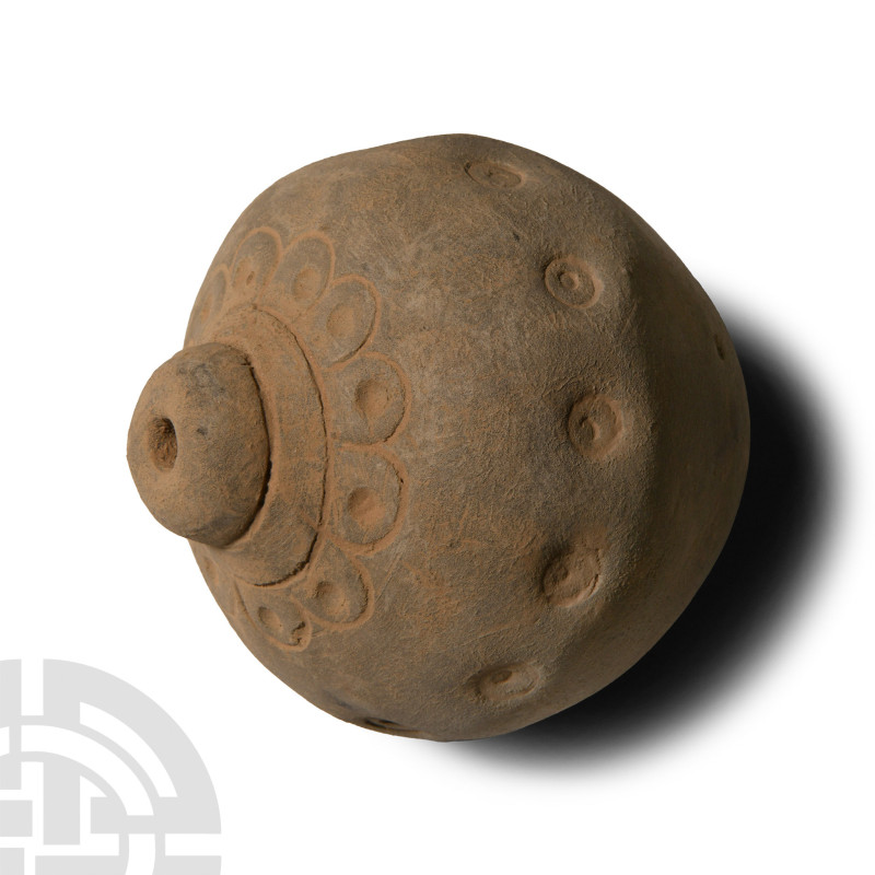 9th-11th century A.D.. Piriform body with domed filler-hole surrounded with impr...