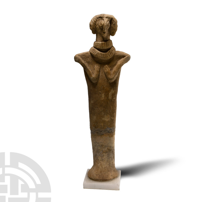 1500-500 B.C.. Standing female deity (Astarte?), wearing a long cloak and two br...