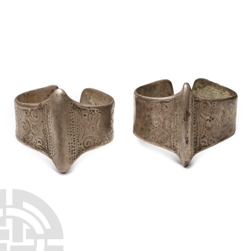 10th-11th century A.D.. Matched pair, each a penannular band with vertical keel ...