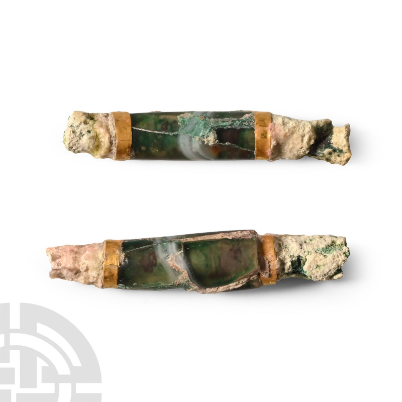 1st millennium B.C.. Comprising two tubular banded green beads with gold collars...