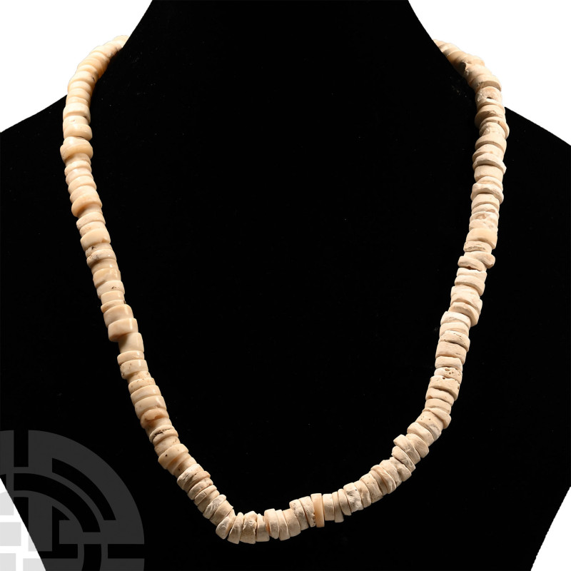 4th-2nd millennium B.C.. Restrung necklace of graduated marine shell discs. 125 ...