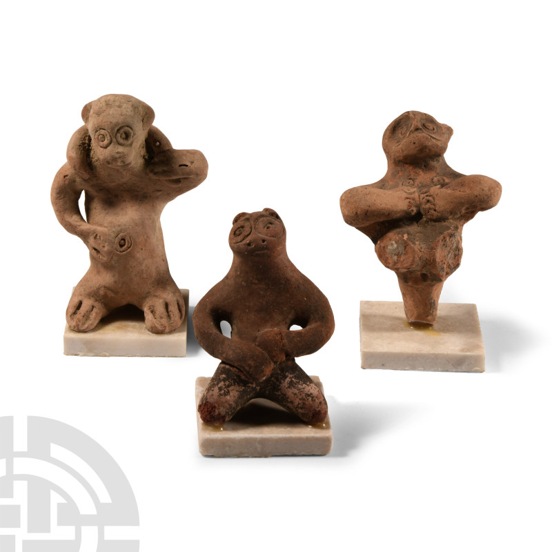 1st millennium B.C.. Each a simian with exaggerated eyes, mounted on a stand. 42...