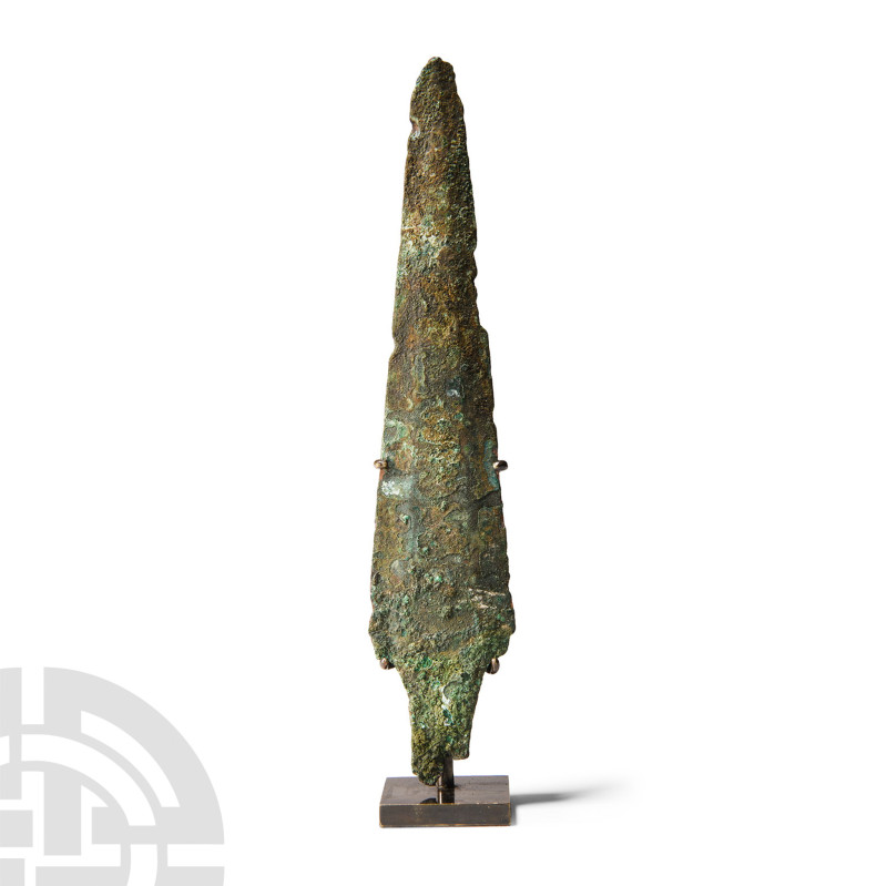 2nd millennium B.C.. With a narrow pointed blade and wide raised flange down cen...