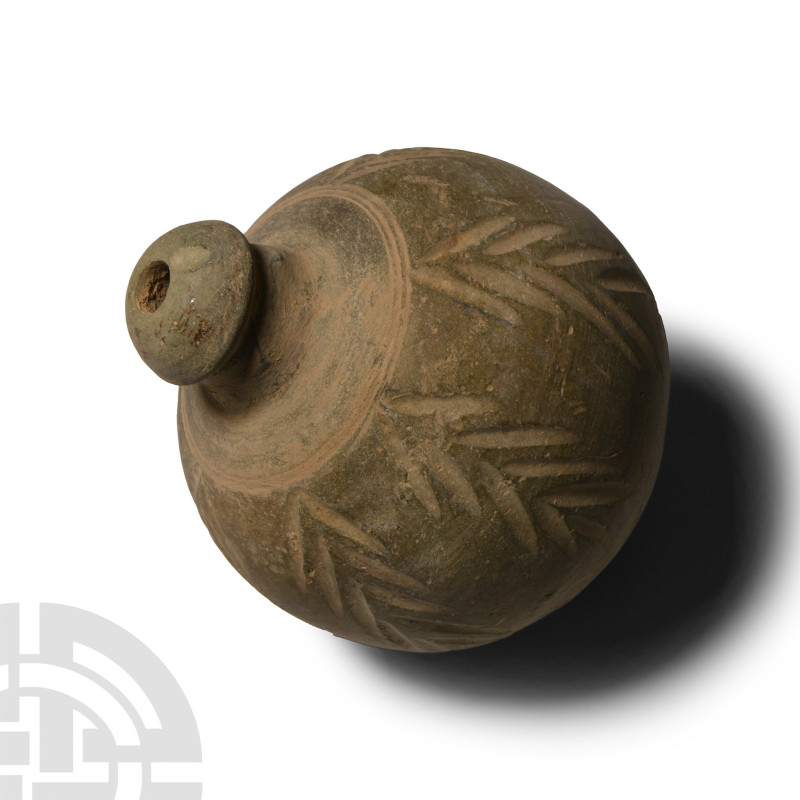 9th-11th century A.D.. Piriform body with domed filler-hole, the body decorated ...