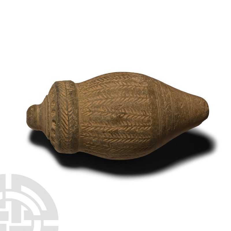 13th-15th century A.D.. A hollow vessel with cylindrical body, carinated shoulde...