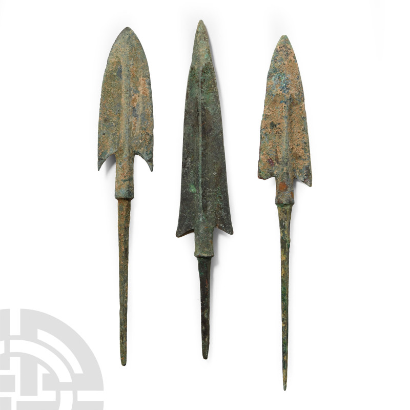 Circa 14th-10th century B.C.. Each with a sturdy square-section tang, narrow bar...