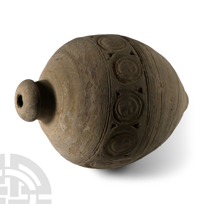 9th-11th century A.D.. An ovate ceramic missile with impressed band of roundels ...